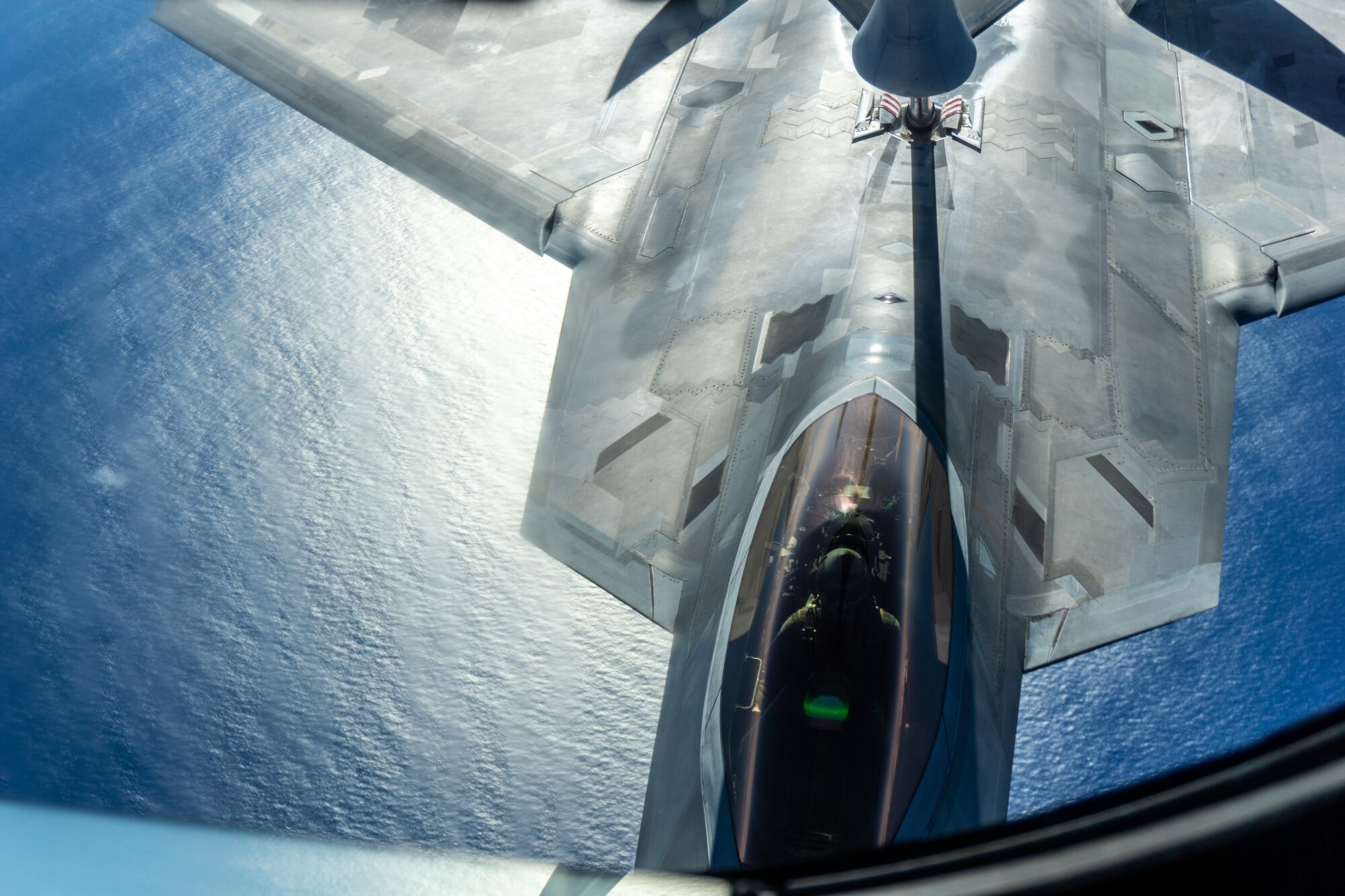 A KC-135 Stratotanker operated by Team Hickam refuels an F-22 Raptor during a routine training mission over the Hawaiian Islands, May 14, 2020.