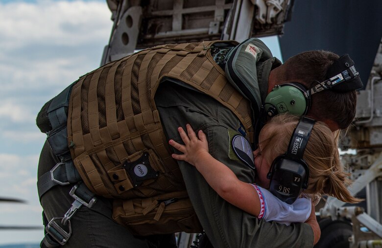 Capt. Robert Flemming embraces his daughter after deployment.