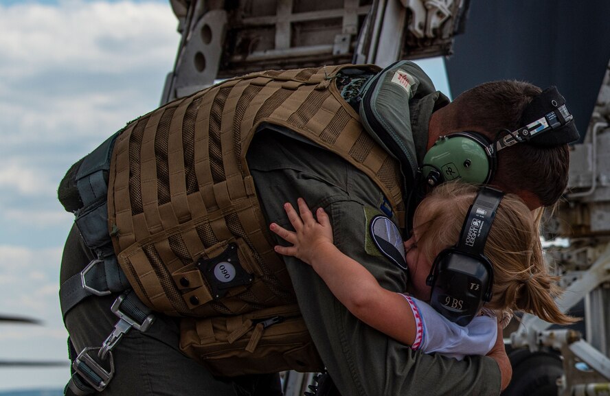 Capt. Robert Flemming embraces his daughter after deployment.