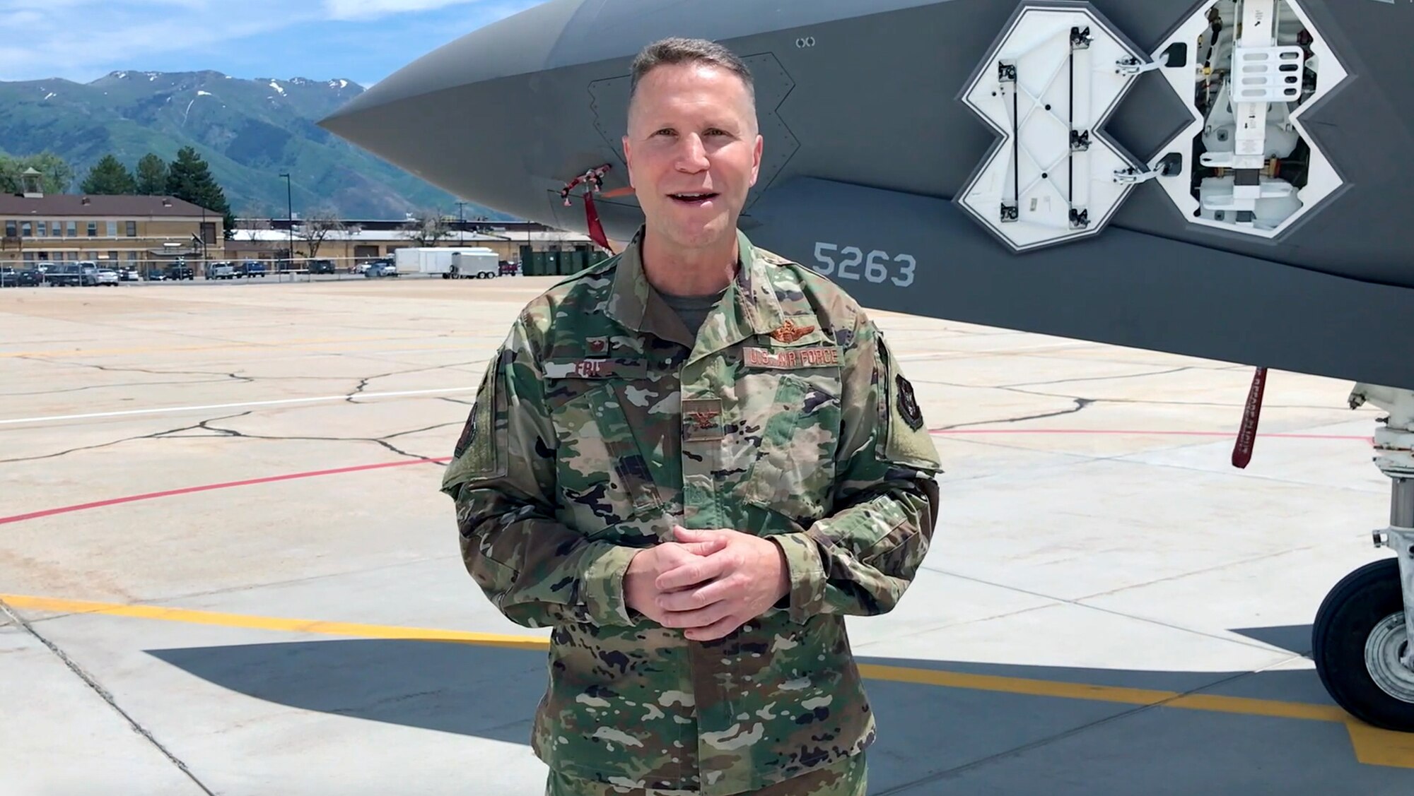Due to COVID-19 restrictions on mass gatherings, the new 419th Fighter Wing commander, Col. Matthew "Eddie" Fritz, addresses wing personnel via video from the Hill Air Force Base flightline