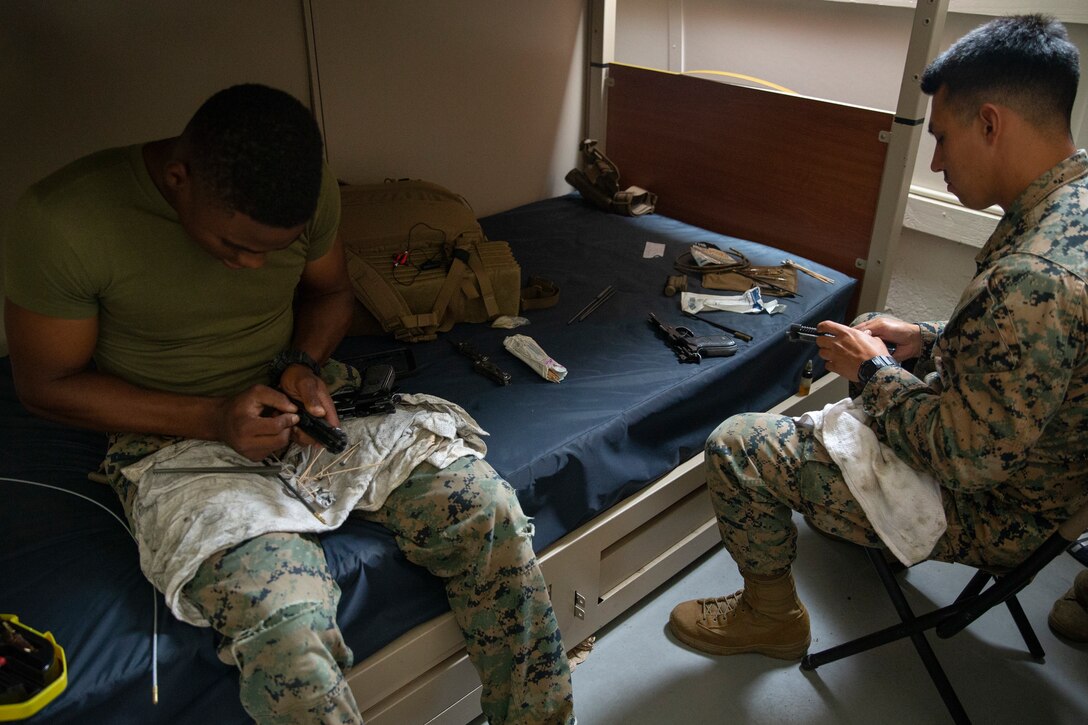 Performing routine maintenance to ensure a weapon is clean and functional is a key part of being ready to fight in any clime or place. (U.S. Marine Corps photo by Cpl. Patrick Crosley)