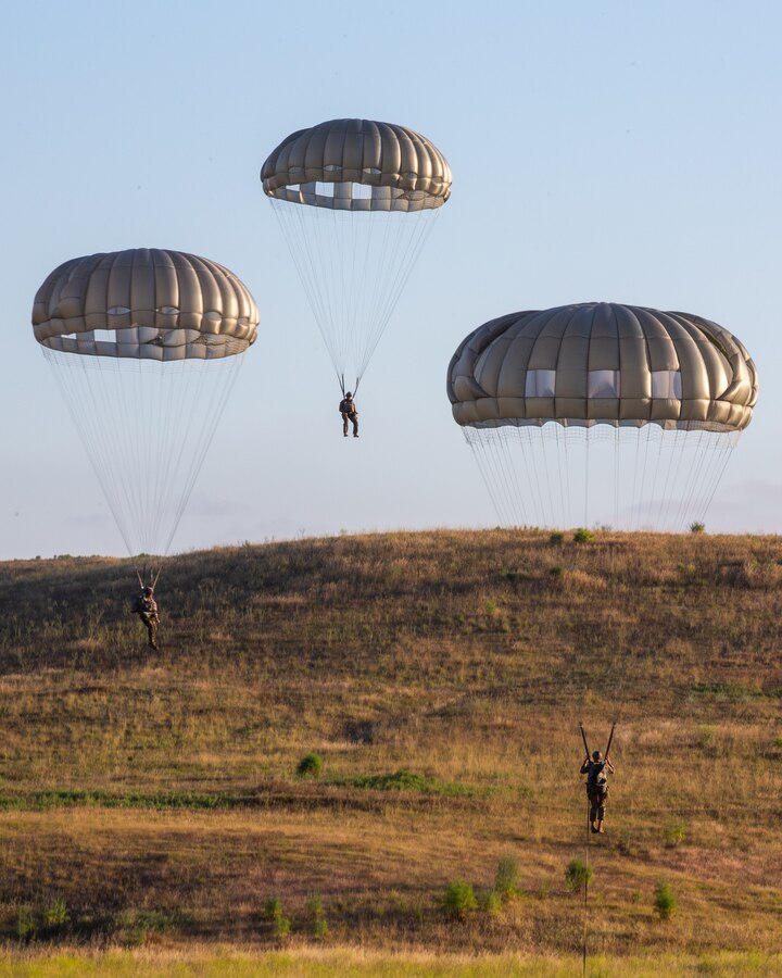 U.S. Marines with All-Domain Reconnaissance Detachment, 15th Marine Expeditionary Unit, prepare to land during static line parachute operations at Marine Corps Base Camp Pendleton, California, May 26, 2020. The parachute training honed participants’ tactical readiness for insertion into locations where other methods may not be viable. (U.S. Marine Corps photo by Cpl. Patrick Crosley)