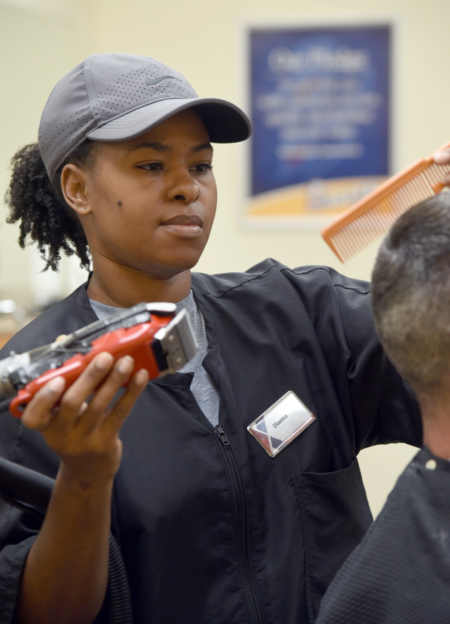 Dianna Colbert is a hair stylist at the barber shop inside the Tinker Exchange and has worked here for 10 years.