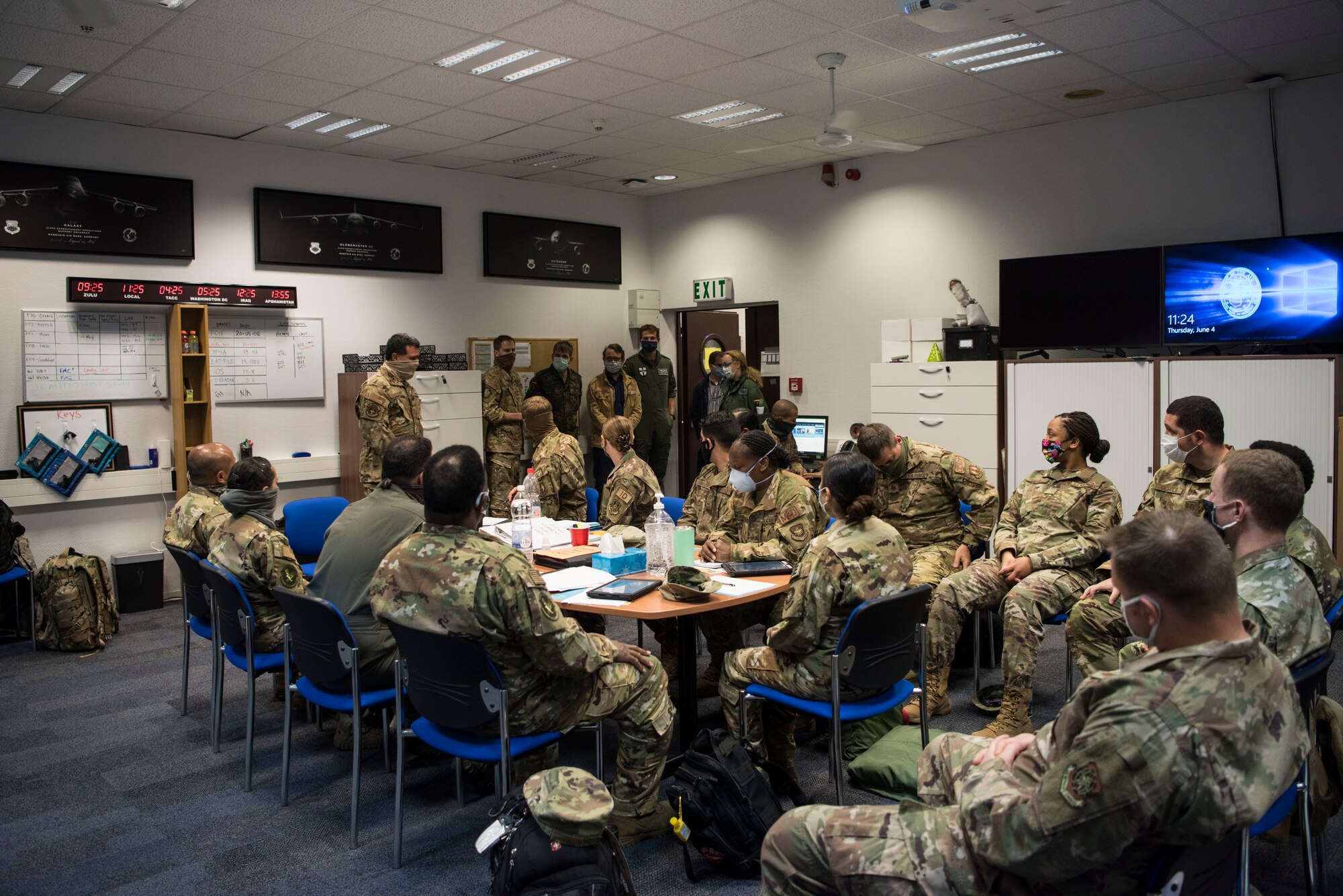 U.S. Air Force Airmen assigned to the 521st Air Mobility Operations Wing meet with German Air Force aerospace medical professionals.