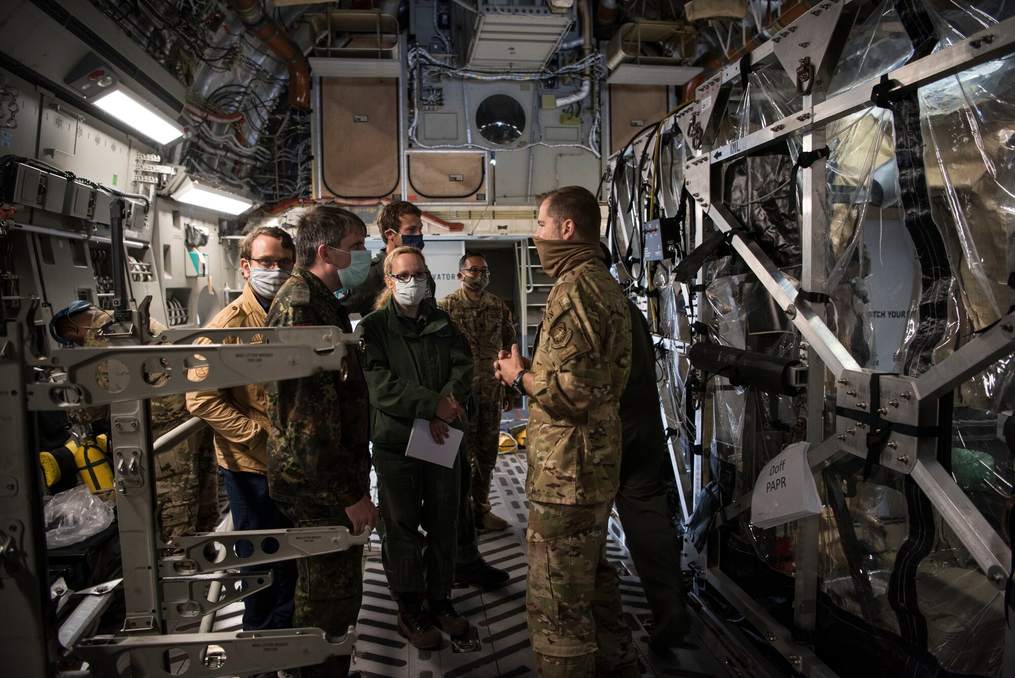 U.S. Air Force Maj. Sean Smith, 10th Expeditionary Aeromedical Evacuation Flight aeromedical evacuation operations team officer in charge, gives a briefing to medical professionals from the German air force’s center for aerospace medicine.