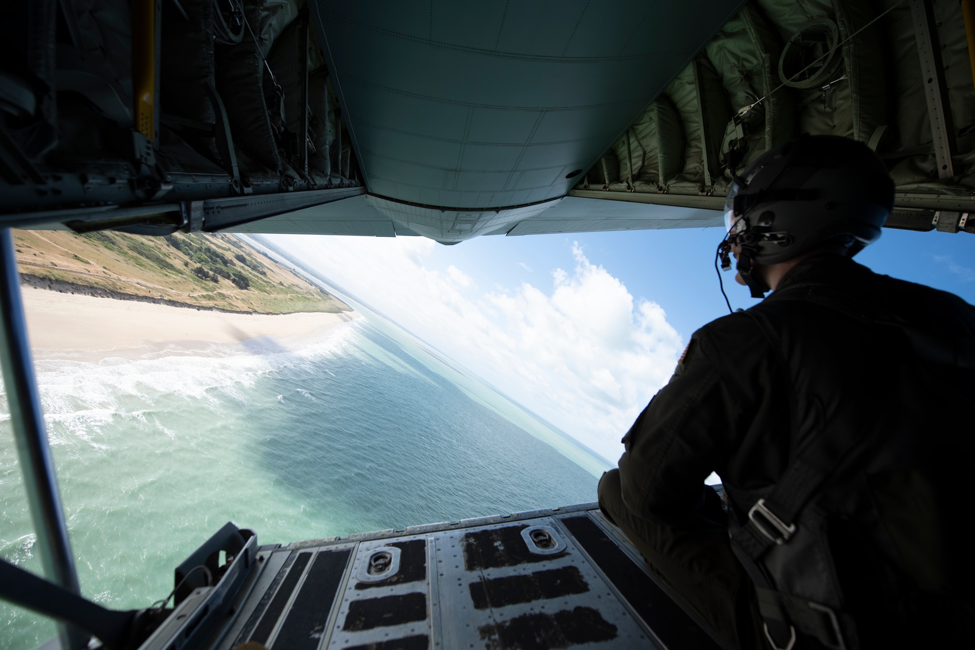 A photo of an Airman looking at the ocean.