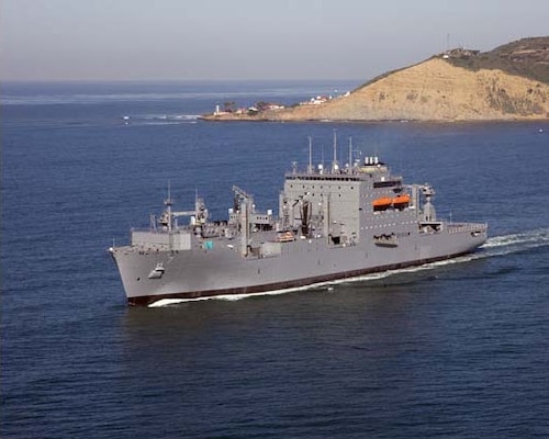 Dry Cargo/Ammunition Ship. Deliver supplies to customer ships at sea — ammunition, food, repair parts, stores and small quantities of fuel. Replace T-AE, T-AFS and T-AOE when operating with T-AO. Two dedicated ships provide ammunition, food, repair parts, stores and small quantities of fuel for the U.S. Marine Corps. Length: 689 ft, Beam: 106 ft, Displacement: 41,000 tons, Speed: 20 knots, Civilian: 129. Government-owned