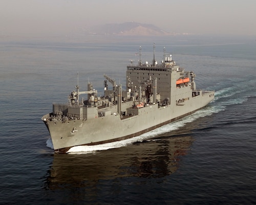 Dry Cargo/Ammunition Ship. Deliver supplies to customer ships at sea — ammunition, food, repair parts, stores and small quantities of fuel. Replace T-AE, T-AFS and T-AOE when operating with T-AO. Two dedicated ships provide ammunition, food, repair parts, stores and small quantities of fuel for the U.S. Marine Corps. Length: 689 ft, Beam: 106 ft, Displacement: 41,000 tons, Speed: 20 knots, Civilian: 129. Government-owned