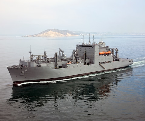 Dry Cargo/Ammunition Ship. Deliver supplies to customer ships at sea — ammunition, food, repair parts, stores and small quantities of fuel. Replace T-AE, T-AFS and T-AOE when operating with T-AO. Two dedicated ships provide ammunition, food, repair parts, stores and small quantities of fuel for the U.S. Marine Corps. Length: 689 ft, Beam: 106 ft, Displacement: 41,000 tons, Speed: 20 knots, Civilian: 129. Government-owned