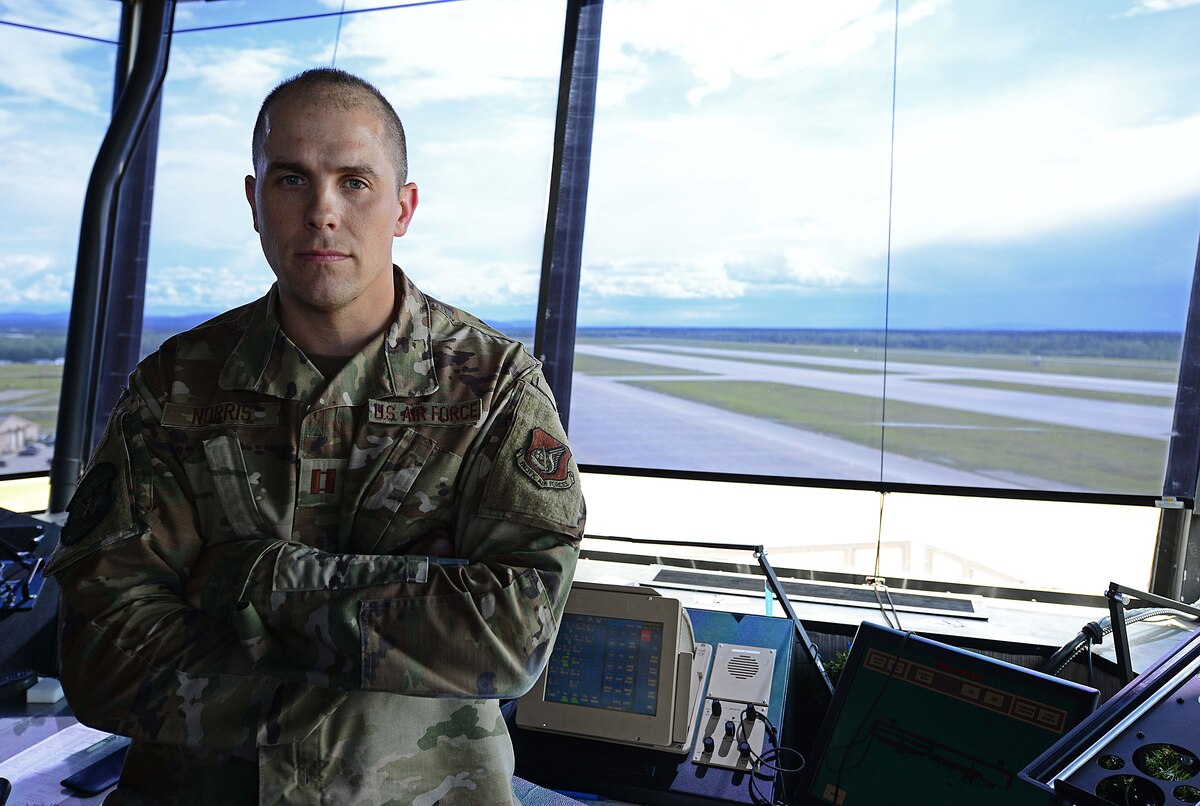 U.S. Air Force Capt. Robert Norris, the 354th Operations Support Squadron airfield operations flight commander, scans the flight line on Eielson Air Force Base, Alaska, June 2, 2020. Norris is responsible for leading 44 personnel where he manages $21 million in facilities and equipment enabling 22 thousand flying operations per year on the Air Force’s third longest runway. (U.S. Air Force photo by Staff Sgt. Sean Martin)