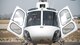 A photo of a pilot conducting pre-flight in a helicopter