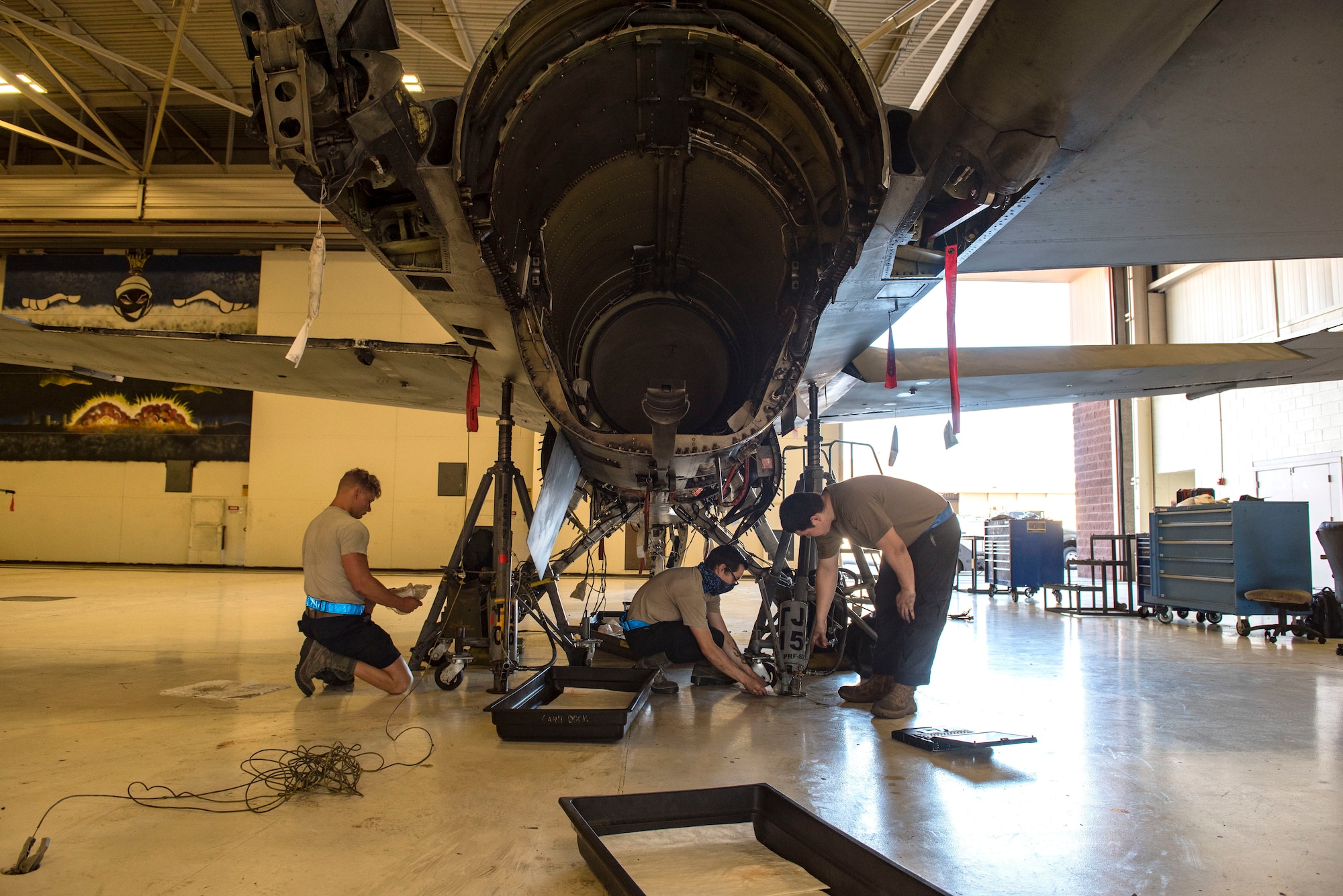 Airmen from the 311th Aircraft Maintenance Unit perform maintenance on an F-16 Viper, June 4, 2020, on Holloman Air Force Base, N.M. The Airmen are replacing 11 wire harnesses and have been working on the project since early May 2020. (U.S. Air Force photo by Staff Sgt. Christine Groening)