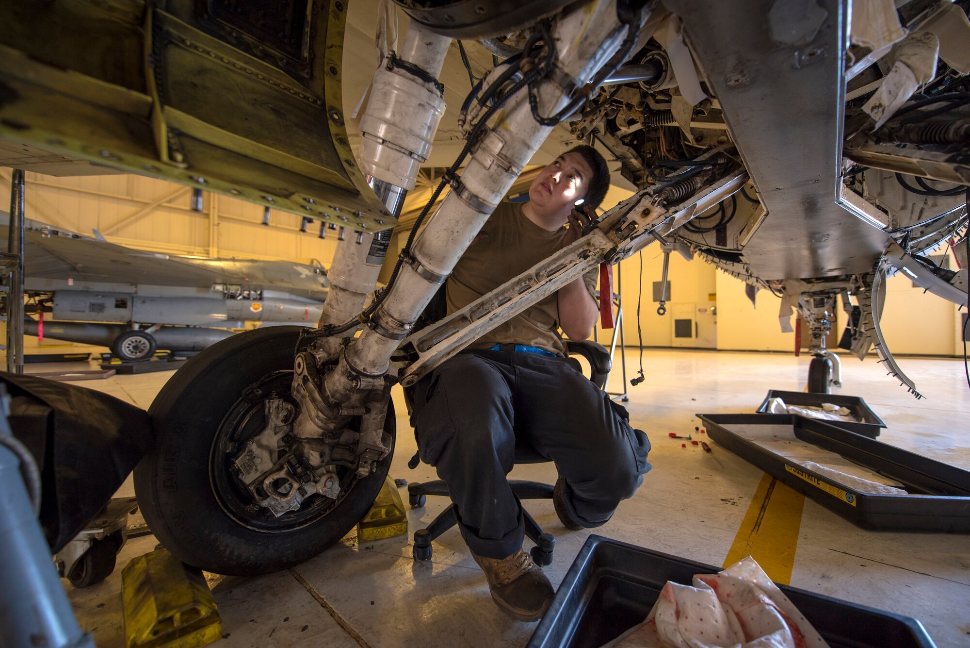 Staff Sgt. Chase Doering, 311th Aircraft Maintenance Unit avionics craftsman, performs maintenance on an F-16 Viper, June 4, 2020, on Holloman Air Force Base, N.M. Airmen from the 311th AMU are replacing 11 wire harnesses in the 31-year-old aircraft that caught fire last year. (U.S. Air Force photo by Staff Sgt. Christine Groening)