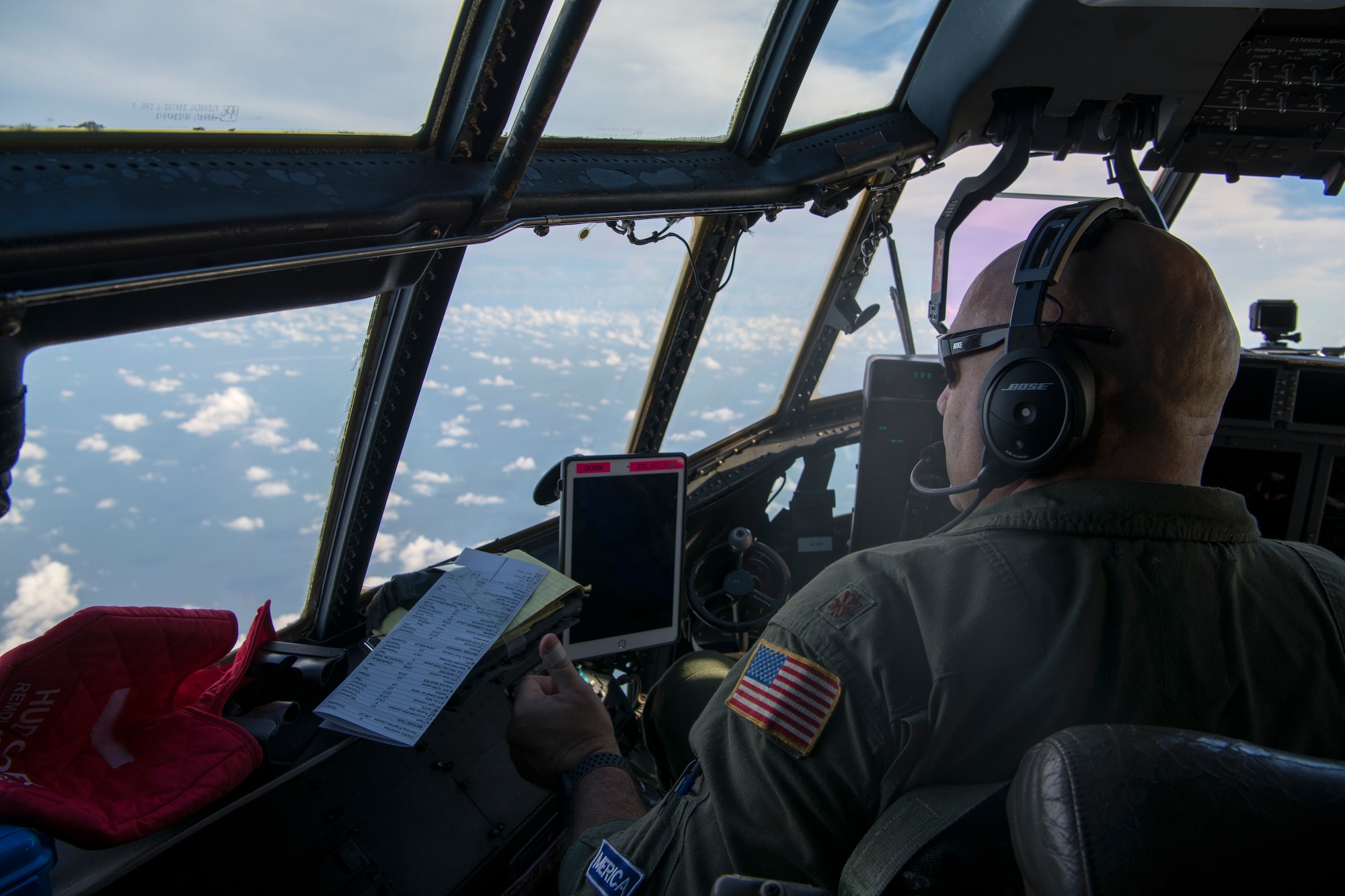 Maj. Kendall Dunn, 53rd Weather Reconnaissance Squadron pilot, looks out the port side of a WC-130J Super Hercules aircraft June 5, 2020 in the Gulf of Mexico. The Hurricane Hunters were tasked to fly a fixed mission to locate the center of Tropical Storm Cristobal and the data gathered was sent to the National Hurricane Center for their weather model forecasts. (U.S. Air Force Photo by Tech. Sgt. Christopher Carranza)