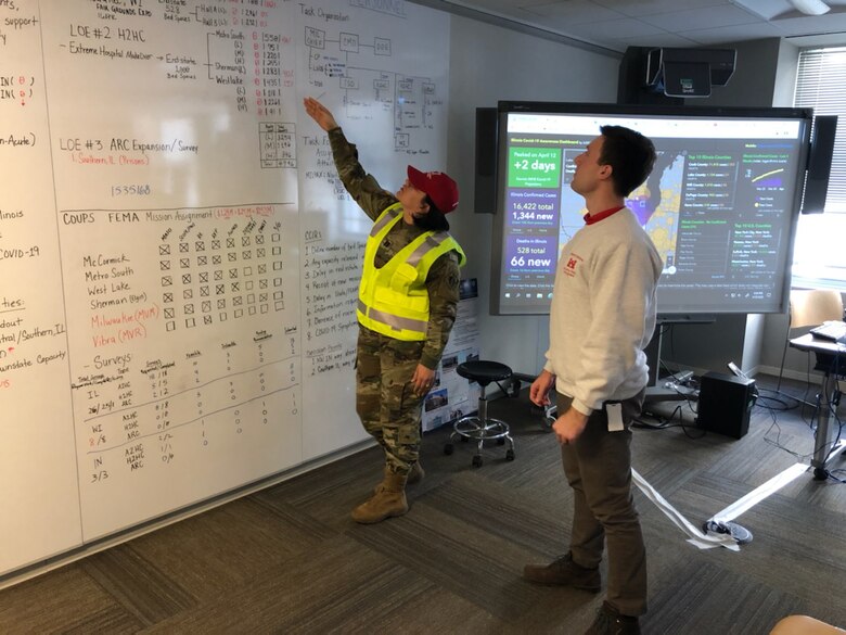 Capt. Carolyn N. Ortiz-Merced discusses the U.S. Army Corps of Engineers Chicago District’s COVID-19 projects while serving as the battle captain in the district’s Emergency Operations Center during the fight against COVID-19.
