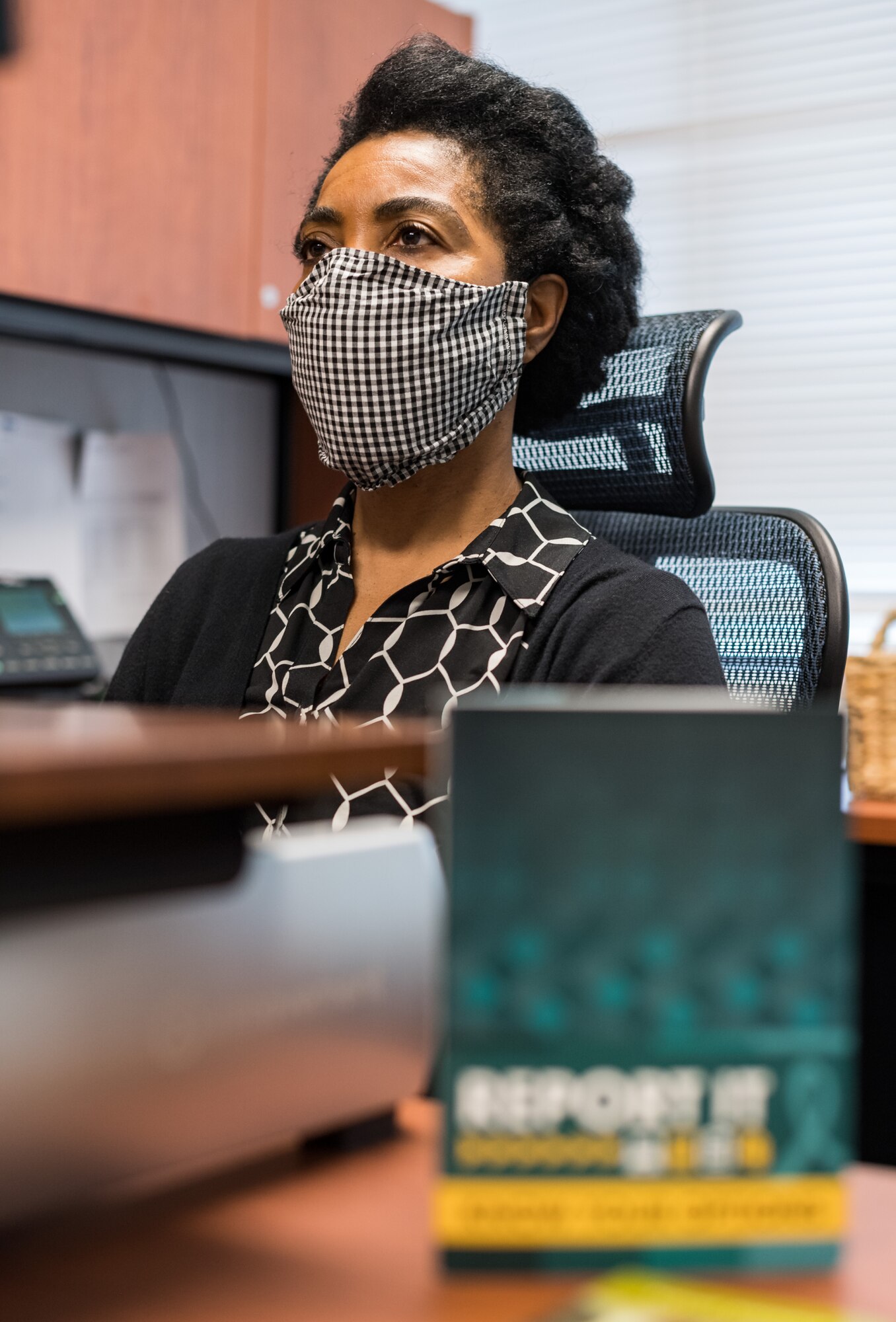 Gail Reed-Attoh, 436th Airlift Wing Sexual Assault Response Coordinator, works at her desk, May 29, 2020, at Dover Air Force Base, Delaware. Reed-Attoh and two alternate SARCs are available 24/7 to support sexual assault victims. (U.S. Air Force photo by Roland Balik)