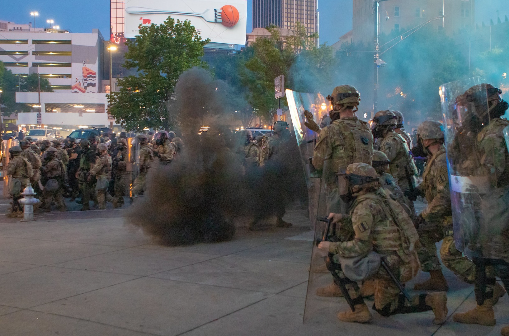 Georgia Army National Guard Soldiers shield themselves during demonstrations in Atlanta, June 2, 2020. Tear gas had to be employed by police that night to stop violence and clear the streets after the 9 p.m. curfew.