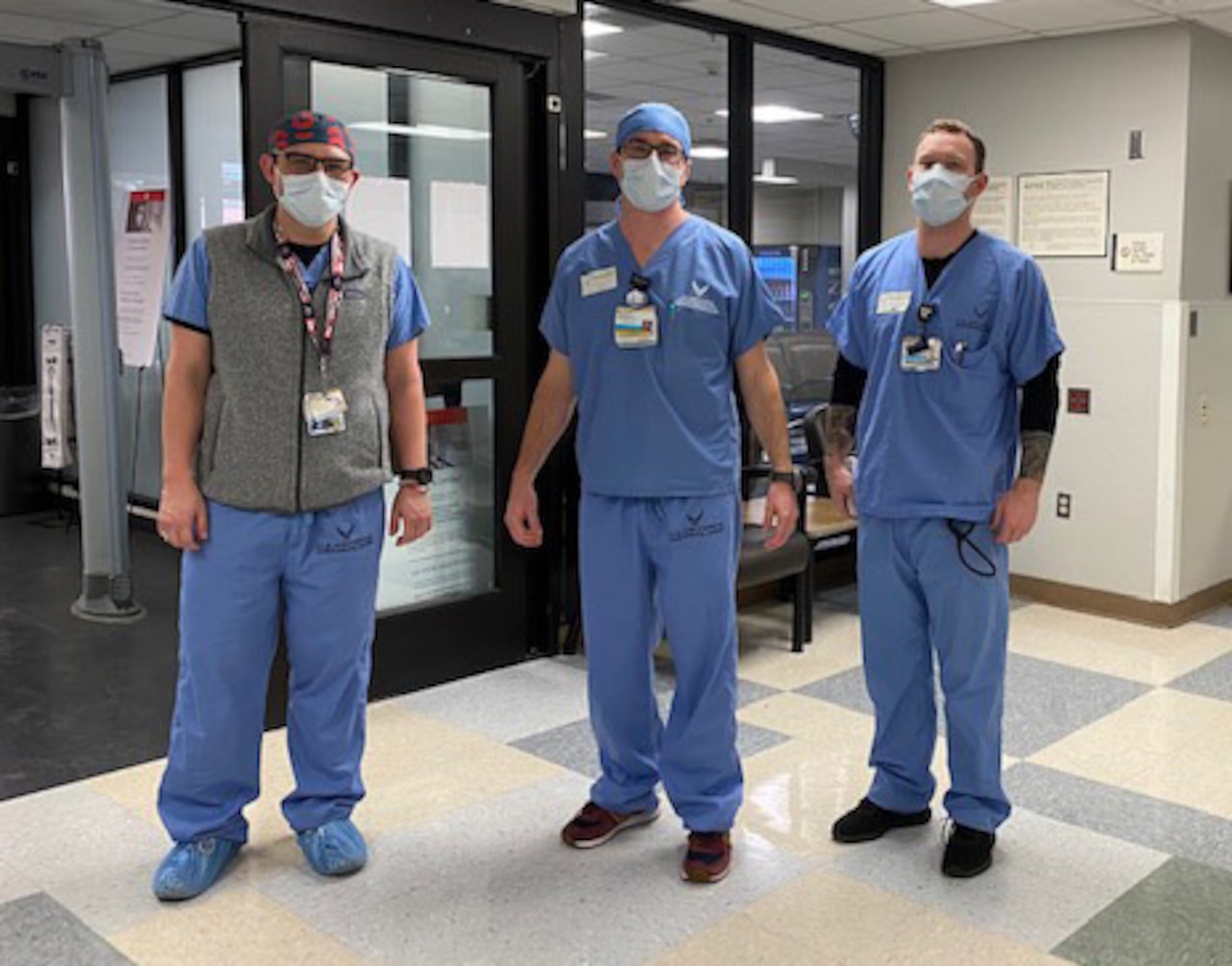 Health care workers wear scrubs donated by the Air Force recruiters.