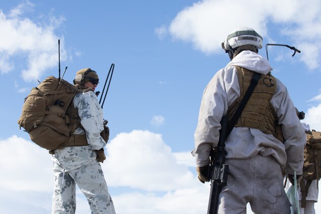 A U.S. Marine and Norwegian soldiers prepare to move to their next destination during Exercise Thunder Reindeer in Setermoen, Norway, May 27th.