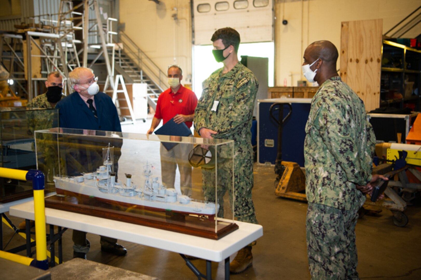 Dana Wegner, Curator of Navy Ship Models shows Rear Adm. Kevin Byrne one of the many models in the Navy’s collection of 3,500 model ships on June 4, 2020.