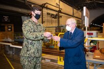 Rear Adm. Kevin Byrne, commander, Naval Surface and Undersea Warfare Centers, presents Dana Wegner with the Department of the Navy Distinguished Civilian Service Award on June 4, 2020.