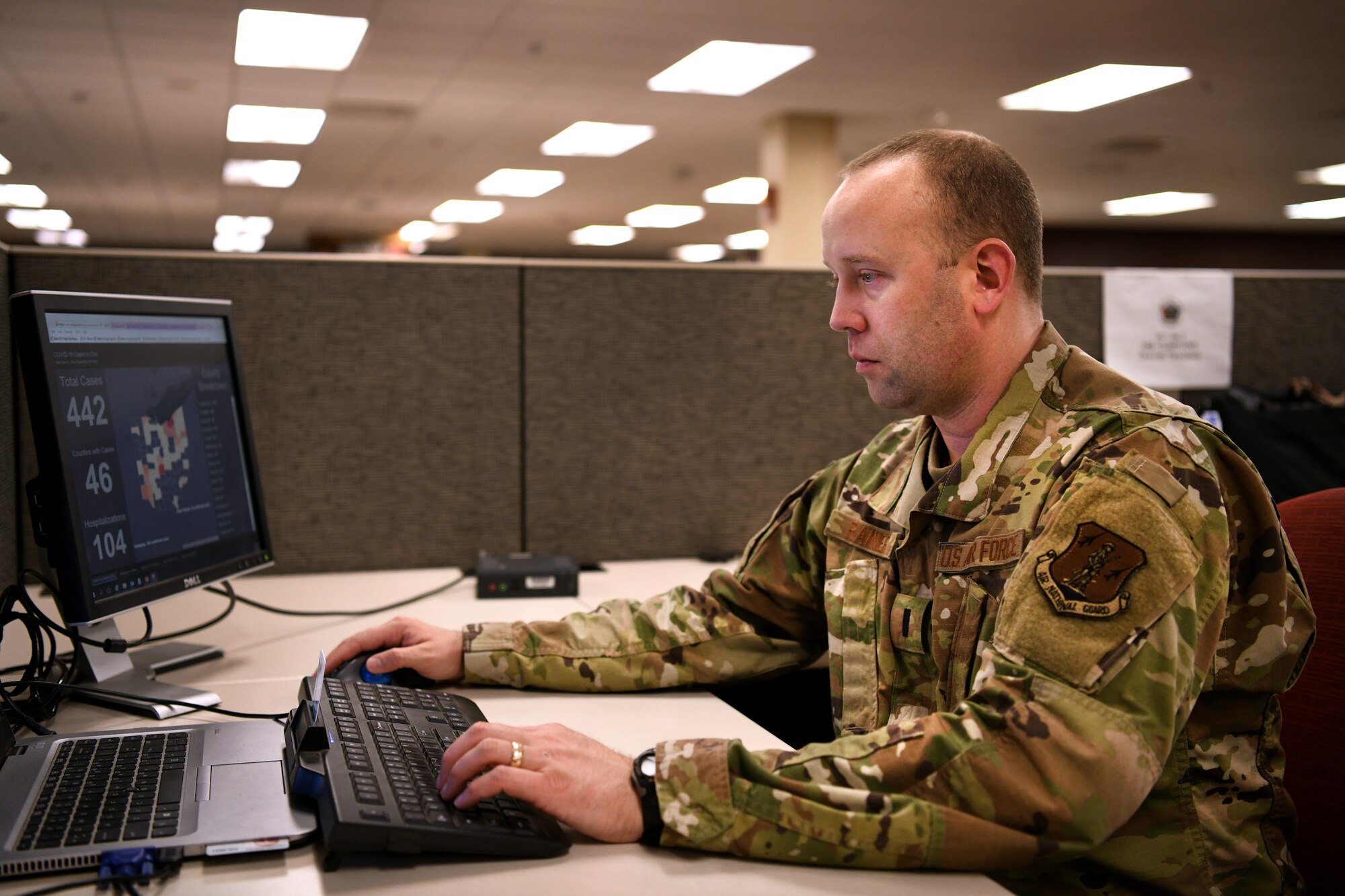 U.S. Air Force 1st Lt. Justin Rainier, a logistics readiness officer assigned to the 178th Wing who was called to State Active Duty and is currently serving on Joint Task Force-37 for Operation Steady Resolve, gathers weather reports for commanders March 23, 2020 at the Defense Supply Center in Columbus, Ohio. Rainier is one of more than 400 members of the Ohio National Guard called to support food distribution efforts at 12 locations across Ohio, serving more than 11 million Ohioans in all 88 counties. (U.S. Air National Guard photo by Tech. Sgt. Shane Hughes)
