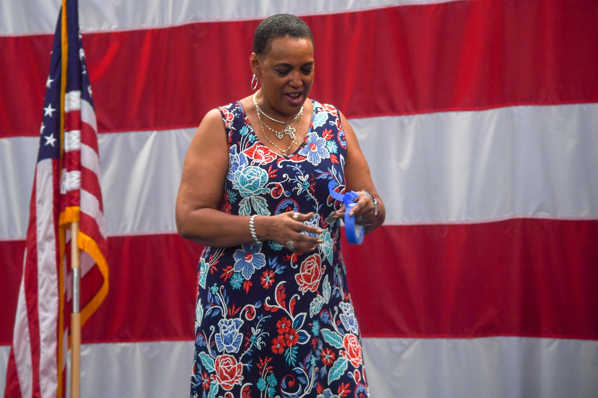 Janice Jones, 2nd Bomb Wing chief of protocol, preps tape to be used as a placeholder during practice of the 96th Bomb Squadron change of command ceremony at Barksdale Air Force Base, La., May 28, 2020. The protocol mission involves keeping leadership informed of where they’re needed for official and social events. (U.S. Air Force photo by Senior Airman Taylor Hunter)