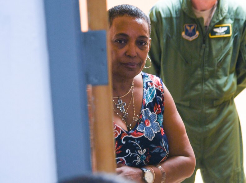 Janice Jones, 2nd Bomb Wing chief of protocol, stands in the doorway directing individuals to enter Hoban Hall on Barksdale Air Force Base, La., May 28, 2020. Protocol mission involves keeping leadership where needed for official and social events  (U.S. Air Force photo by SrA Taylor Hunter)