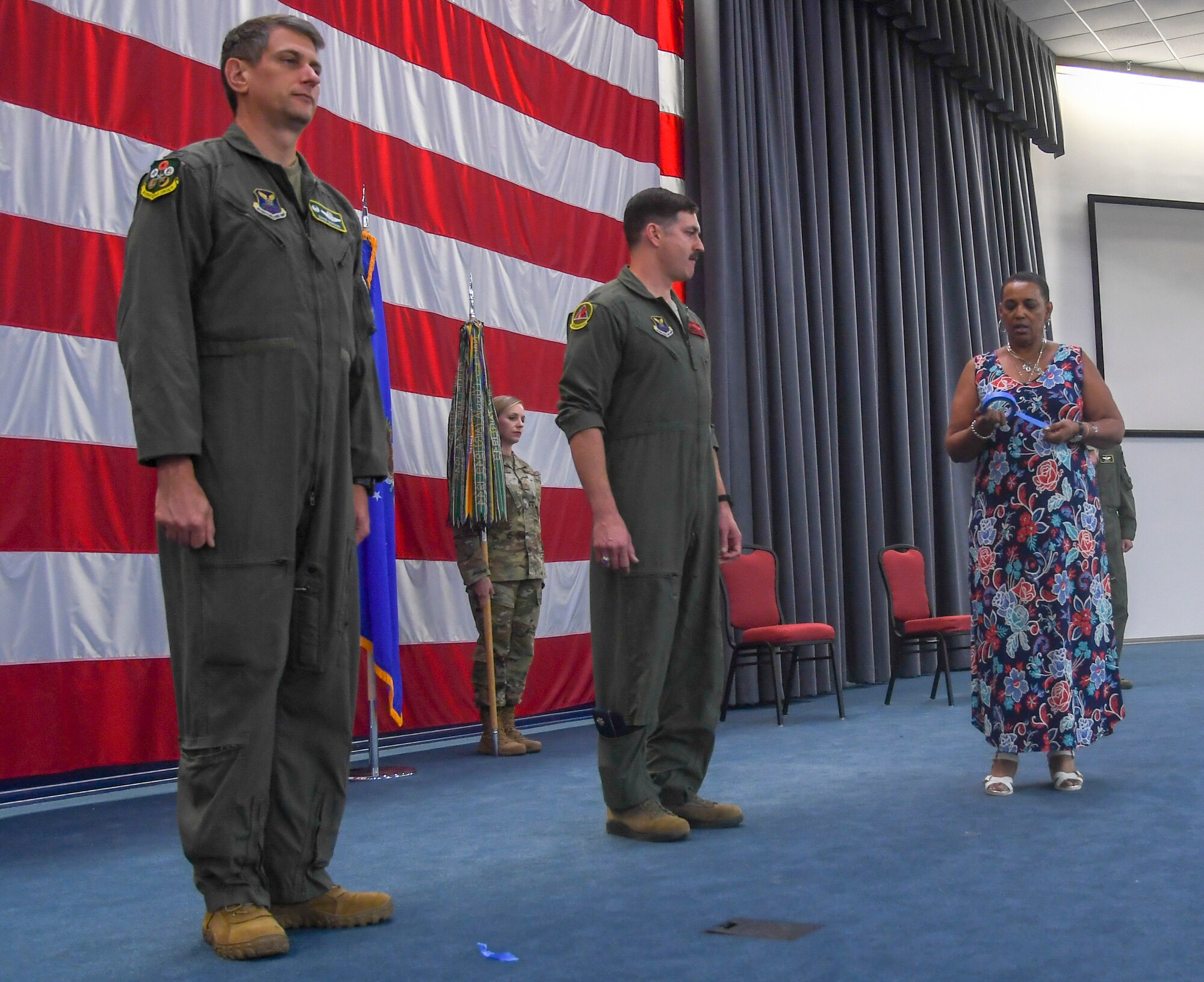 Col. David Gordon, 2nd Operations Group commander; Lt. Col. John Baker, outgoing 96th Bomb Squadron commander; and Master Sgt. Megan Moorehouse, 96th BS superintendent; receive direction from  Janice Jones, 2nd Bomb wing chief of protocol, on Barksdale Air Force Base, La., May 28, 2020. A change of command is a military tradition that represents a formal transfer of authority and responsibility for a unit from one commanding or flag officer to another.(U.S. Air Force photo by SrA Taylor Hunter)