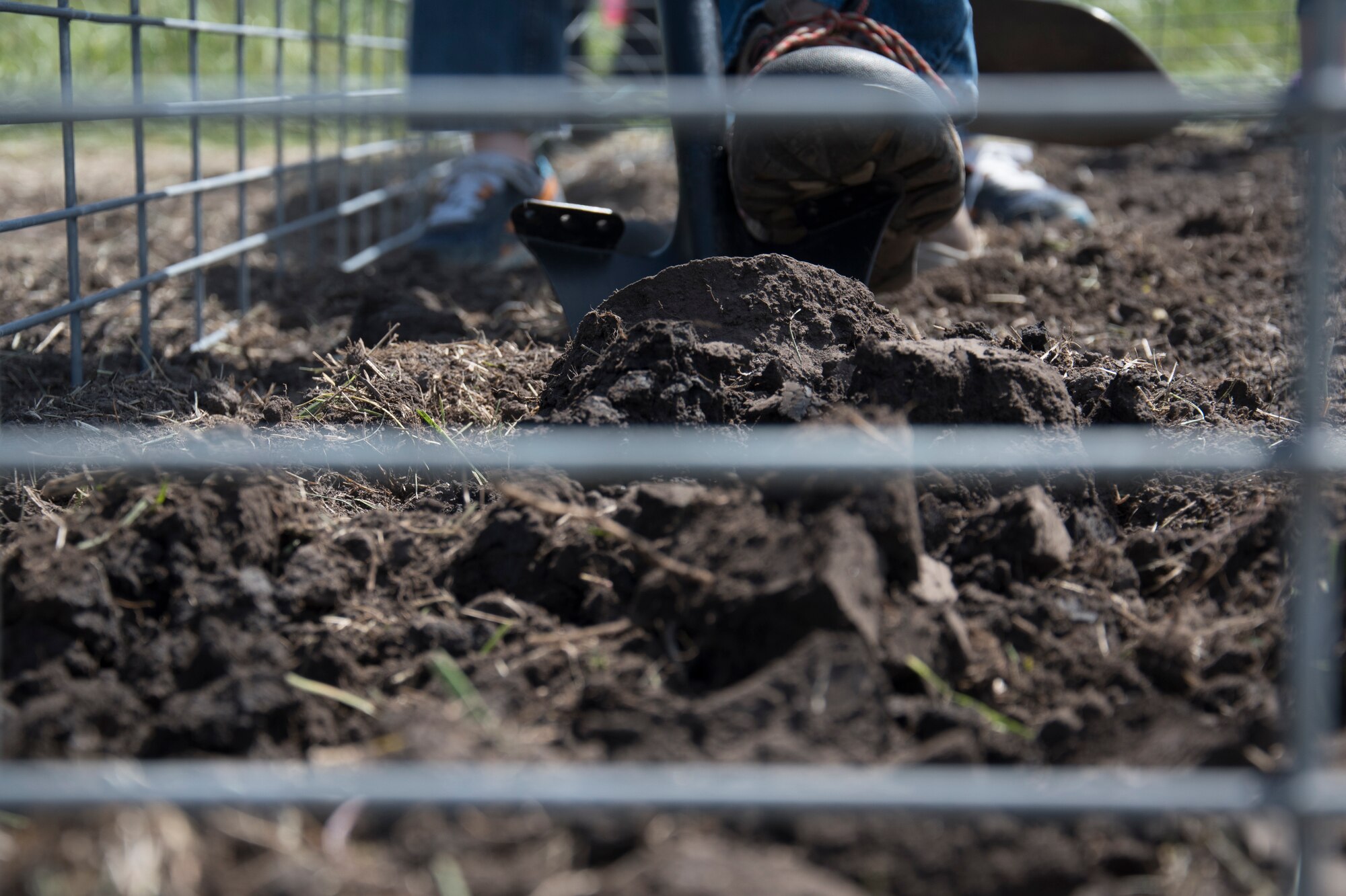 Man uses gardening tools