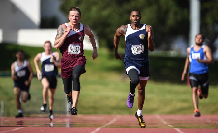 Athletes competing in the 2020 Marine Corps Trials race during the men’s 400 meter dash visually impaired competition at Marine Corps Base Camp Pendleton, Calif., March 5.