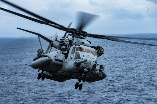 A CH-53E Super Stallion helicopter takes off from a flight during flight operations in the Philippine Sea, March 30.