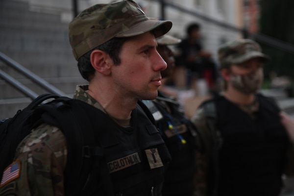 District of Columbia National Guard 1st Lt. John McGlothlin, an Army attorney, patrols Gallery Place Chinatown June 6, 2020, in Washington, D.C. McGlothlin was activated to help keep peace so demonstrators could protest.