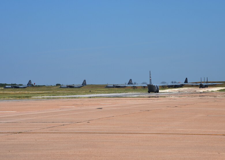 A line of C-130J Super Hercules taxi along the flightline at Dyess Air Force Base, Texas in preparation for an U.S. Air Force Weapons School Joint Forcible Entry exercise June 6, 2020. Approximately eight of Dyess’ aircraft took part in the exercise at Nellis AFB, Nev. (U.S. Air Force photo by Senior Airman Mercedes Porter)