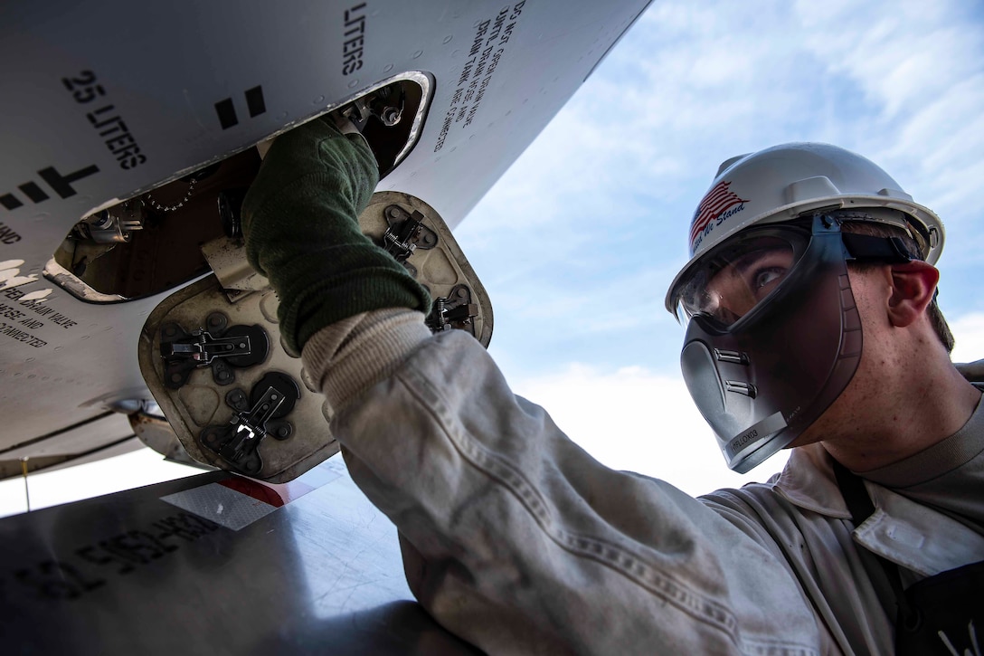 An airman works on an Air Force aircraft.