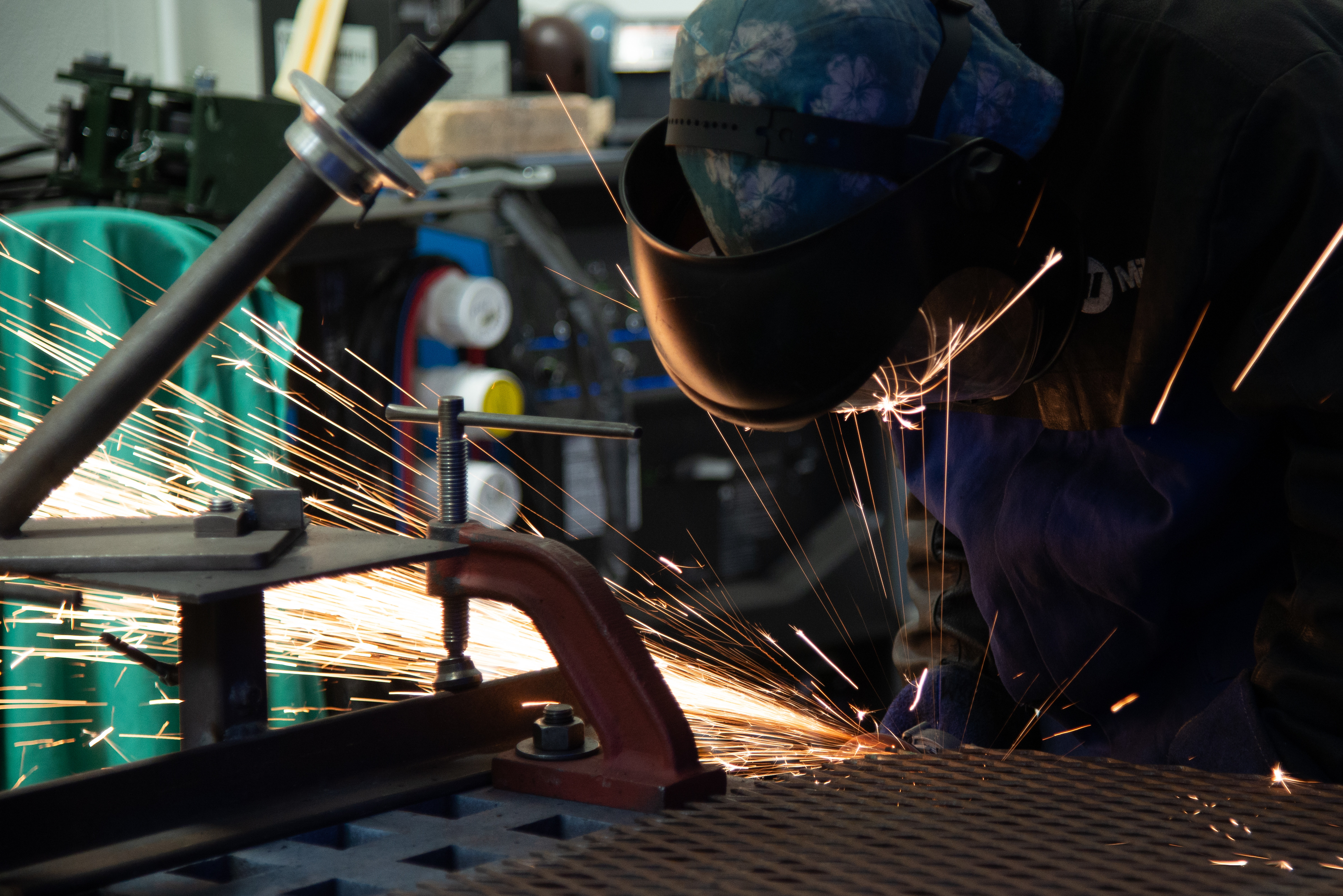 Senior Airman David Ray, 302 Maintenance Squadron metals technician, used a cutting tool to modify a shelf for proper fitting on an equipment rack used during aircraft wash operations June 7, 2020, at Peterson Air Force Base, Colorado. (U.S. Air Force photo by Staff Sgt. Justin Norton)