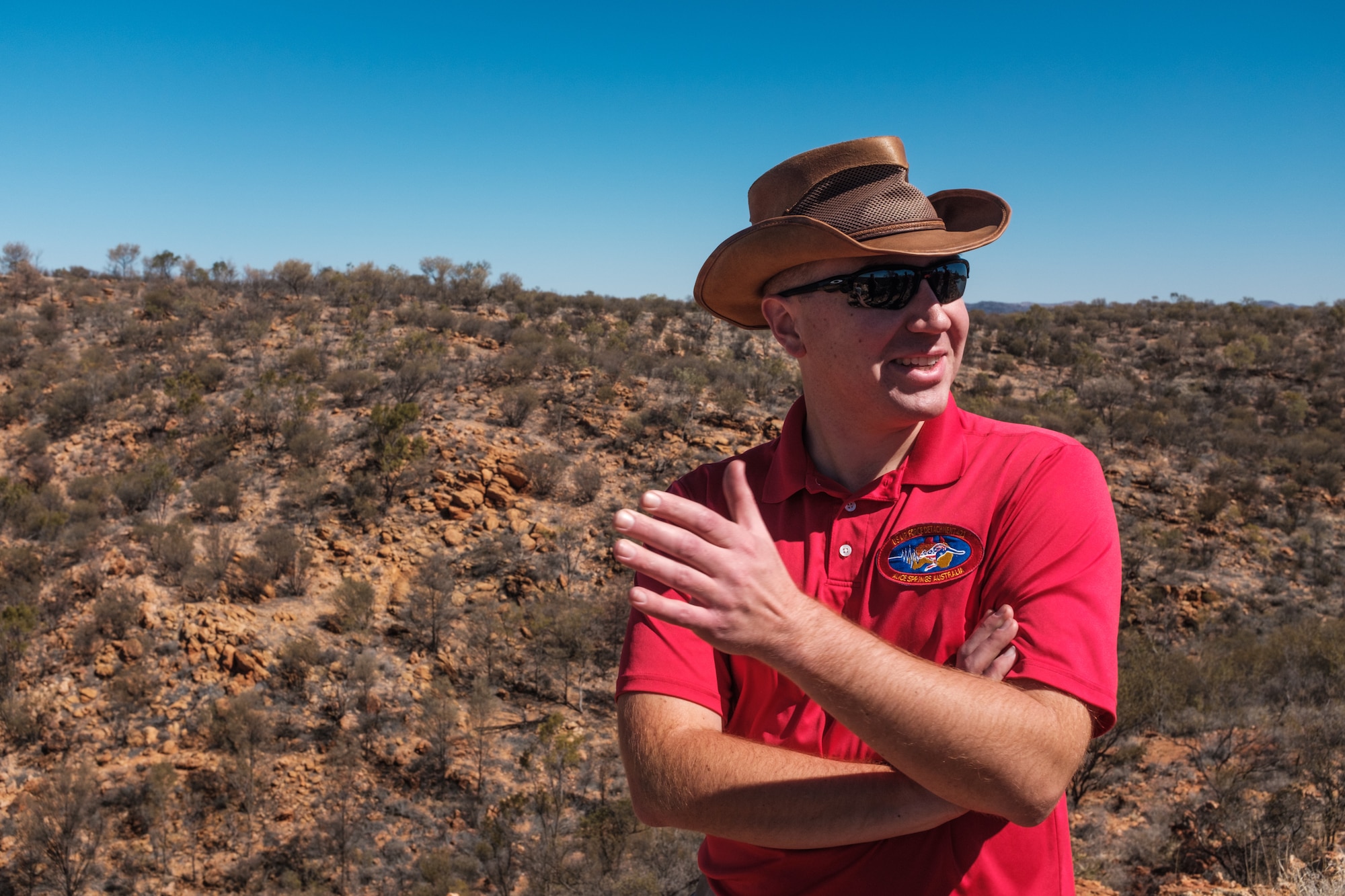 Tech. Sgt. Andrew Bryan, 709th Technical Maintenance Squadron, Detachment 421 noncommissioned officer in charge of maintenance, supervises three Airmen in charge of maintaining a seismic array in the outback of Alice Springs, Australia, Aug. 28, 2019. Data from the array is used to detect seismic activity, to include nuclear detonations or earthquakes. (U.S. Air Force photo by Master Sgt. Benjamin Wilson)