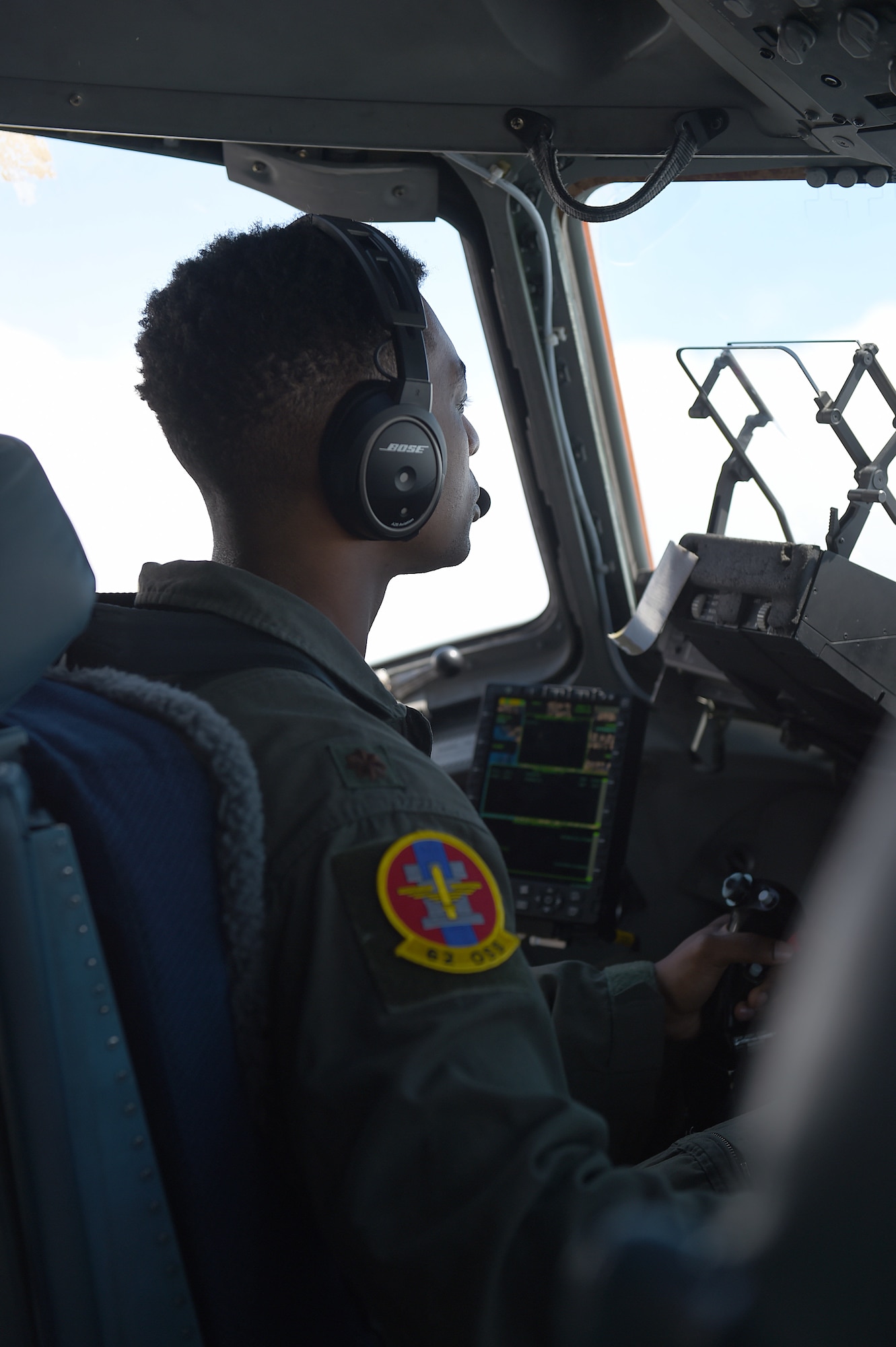 U.S. Air Force Maj. James Hall, 62nd Operations Support Squadron operations officer and pilot, flies a C-17 Globemaster III during a joint force exercise over the Nevada test and training range, June 6, 2020. During this flight Hall tested an updated dynamic re-tasking capability (DRC) system that enabled increased situational awareness of the simulated battle space during the exercise.  (U.S. Air Force photo by Airman 1st Class Mikayla Heineck)