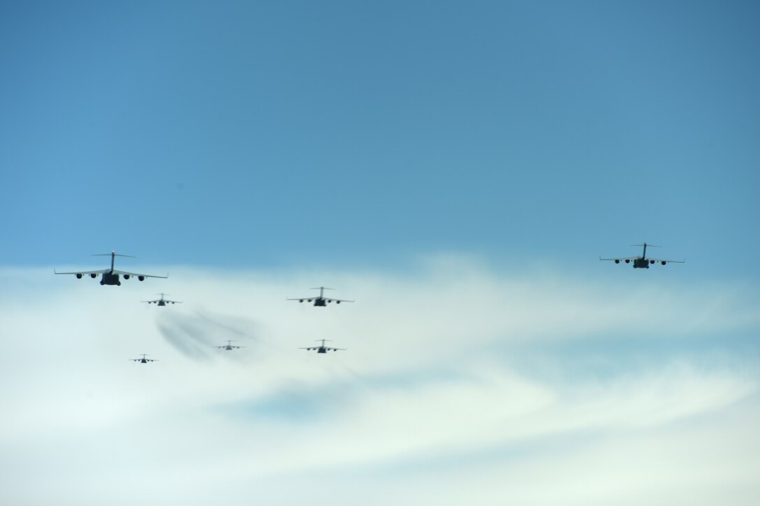 A formation of C-17 Globemaster III aircrafts from the 62nd Airlift Wing, 446th Airlift Wing, and Joint Base Elmendorf-Richardson, fly in a joint force exercise over the Nevada test and training range, June 6, 2020. The C-17’s made up a section of the 87 total aircraft that participated in this exercise which was the capstone event for a weapons instructor course class. (U.S. Air Force photo by Airman 1st Class Mikayla Heineck)