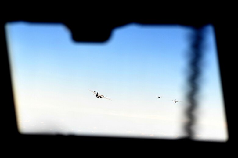 C-130J Super Hercules from Little Rock Air Force Base, Arkansas, fly in formation during a Joint Forcible Entry exercise near Las Vegas, Nevada, June 6, 2020. More than 20 C-130Js and C-17 Globemaster IIIs flew in formation during the U.S. Air Force Weapons School's Joint Forcible Entry exercise with numerous other aircraft from across the Air Force. (U.S. Air Force photo by Senior Airman Kristine M. Gruwell)