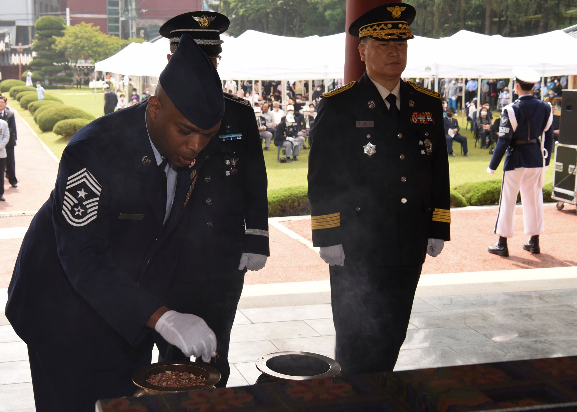 U.S. Air Force Chief Master Sgt. Ronnie Woods, 8th Fighter Wing command chief, pays his respects during the Korean Memorial Day ceremony at Gunsan City, Republic of Korea, June 6, 2020. Korean Memorial Day is a national holiday which commemorates the lives of Korean citizens who died while serving in the military and those who lost their lives during the independence movement. (U.S. Air Force photo by Staff Sgt. Anthony Hetlage)