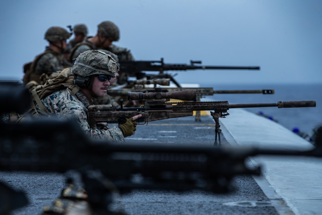 A U.S. Marine prepares an M40A6 sniper rifle for a full mission profile defense of the amphibious task force exercise aboard amphibious assault ship USS America, March 28.