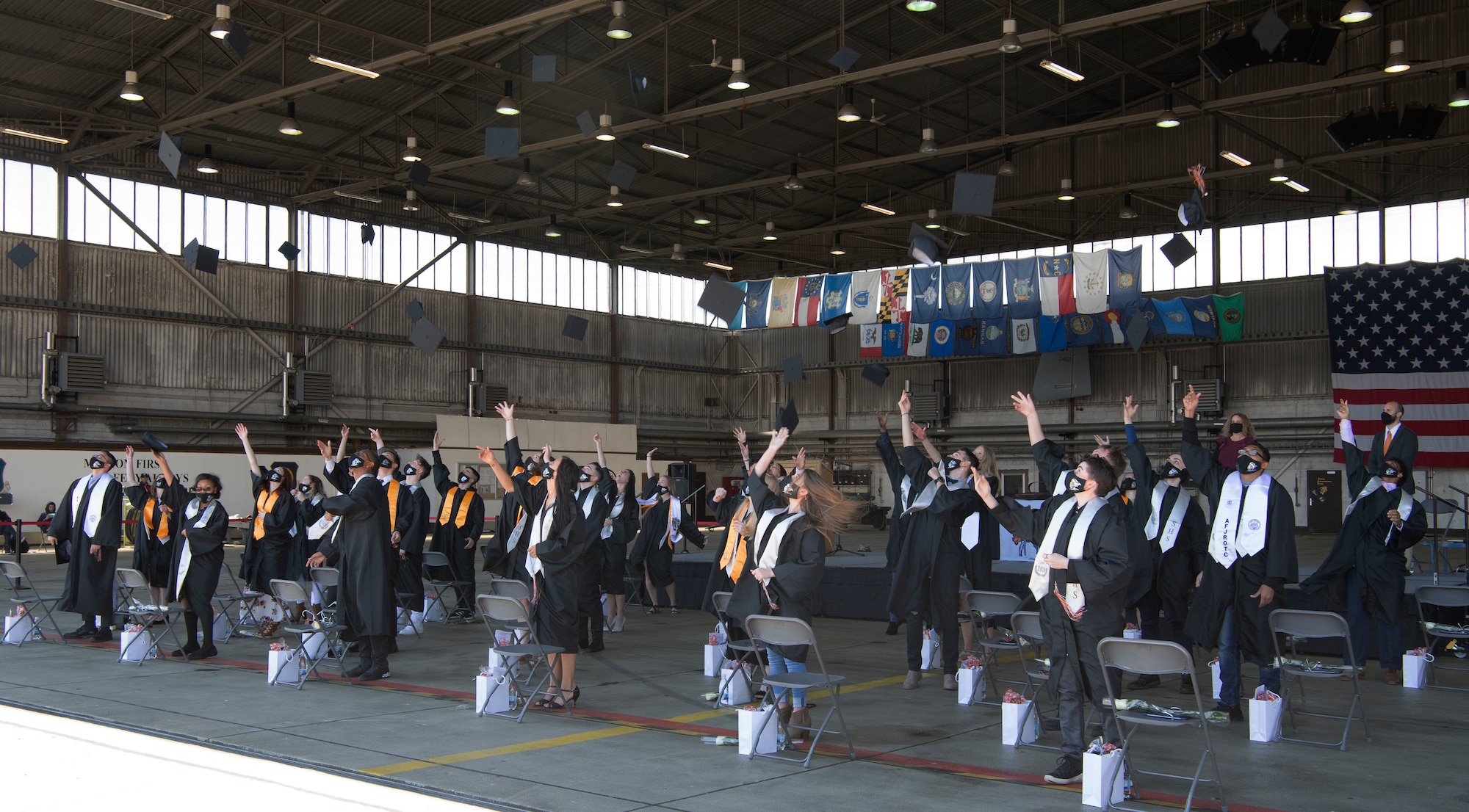 The ceremonial cap throwing symbolizes the end of a chapter in a graduate's life