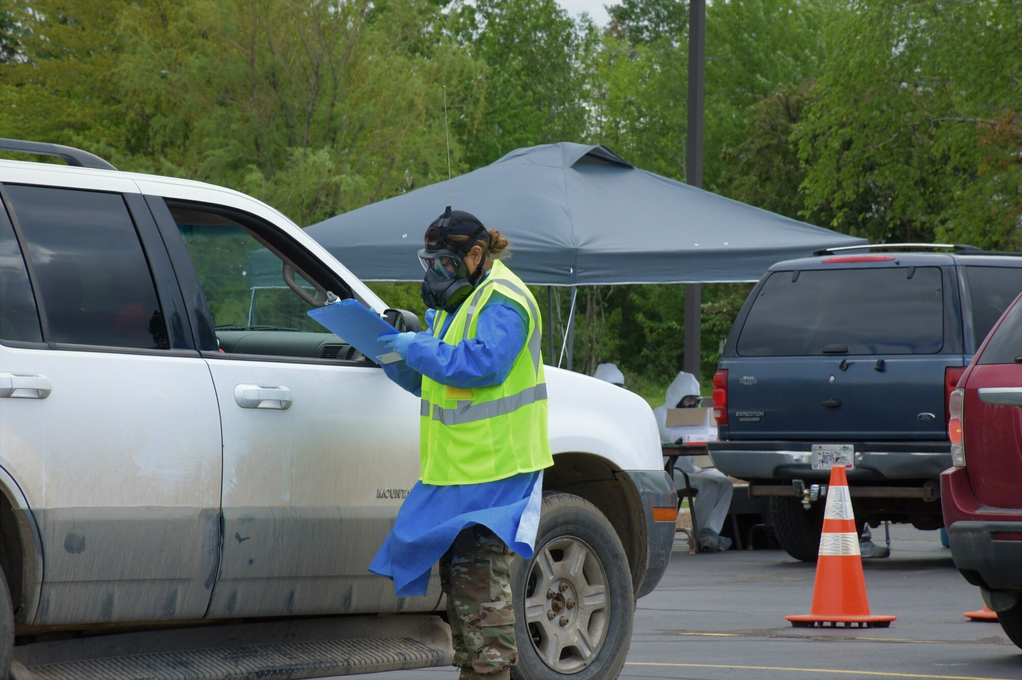 Citizen Airmen and Soldiers, assigned to the Wisconsin National Guard, conduct COVID-19 testing at a community-based testing site in Wisconsin June 3, 2020. The Wisconsin National Guard has 25 COVID-19 specimen collection teams, consisting of 600 Guardsmen and women, operating statewide in an effort to increase Wisconsin's testing capacity.  (Courtesy Photo)