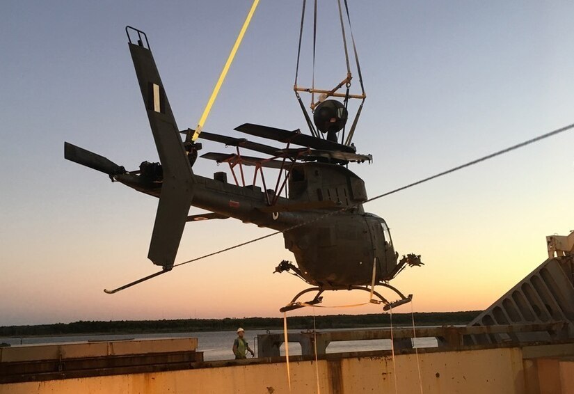 Loading of one of the six flyable aircraft into the transport ship at the port in Jacksonville, Florida.