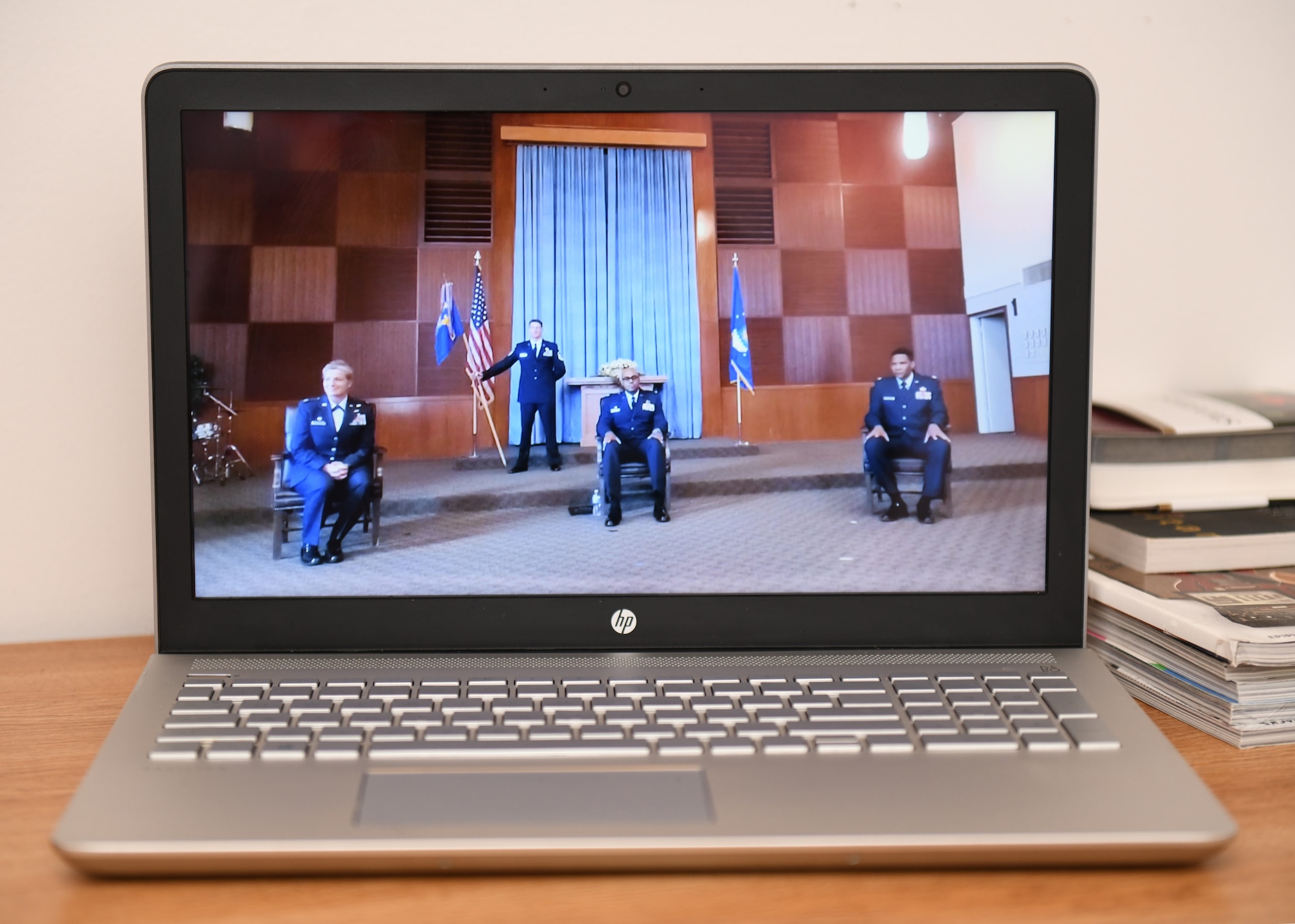 The 9th Logistics Readiness Squadron Change of Command ceremony gets played on a laptop, June 9, 2020, at Beale Air Force Base California. To adhere with Centers of Disease Control social distancing guidelines, changes to reduce physical attendance during ceremonies were put in place, such as limited seating and the addition of virtual attendance. (U.S. Air Force photo by Airman 1st Class Luis A. Ruiz-Vazquez)