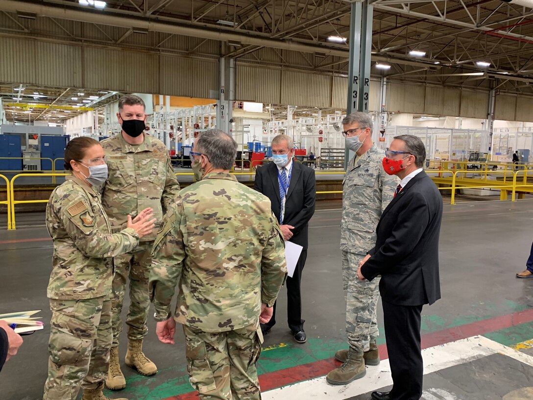 Col. Abby Ruscetta, 76th Propulsion Mantenance Group commander, left, briefs Chief of Staff of the Air Force Gen. David L. Goldfein on depot operations during a tour of Bldg. 9001 June 8. Looking on are, from left, Air Force Sustainment Center Commander Lt. Gen. Gene Kirkland; Mike Mowles, 76th Commodities Maintenance Group deputy director; Oklahoma City Air Logistics Complex Commander Brig. Gen. Chris Hill; and AFSC Executive Director Kevin Stamey. Goldfein visited Tinker Air Force Base to observe firsthand the operational and financial impacts to sustainment due to COVID-19. (U.S. Air Force photo by Jonathan Stock)