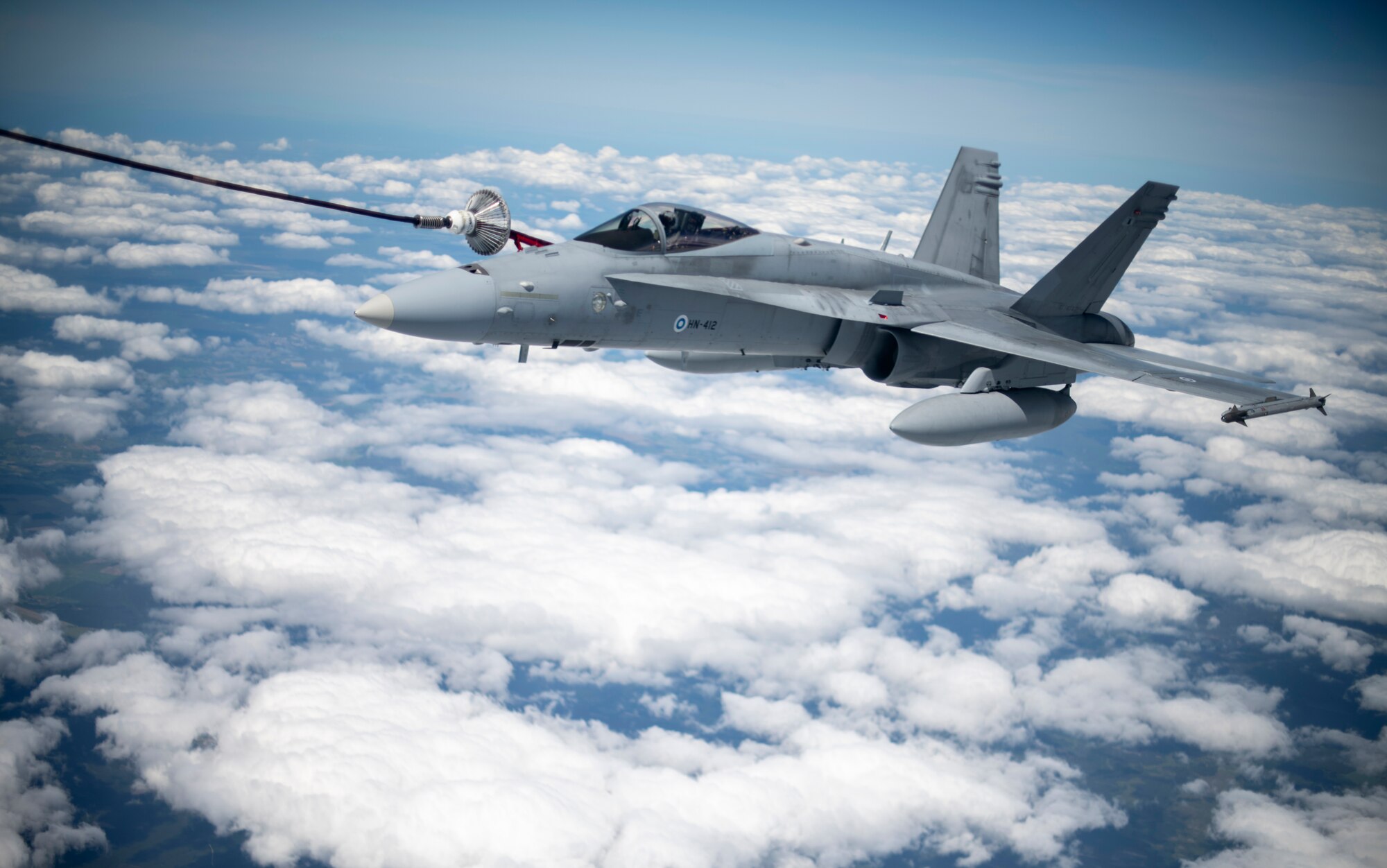 A Finnish air force F/A-18 Hornet is refueled by a U.S. Air Force KC-135 Stratotanker assigned to the 100th Air Refueling Wing, RAF Mildenhall, England, during Exercise Baltic Operations, over Poland, June 9, 2020. BALTOPS brings together a robust professional constellation of allies and partners to conduct operations that safeguard security, prosperity and the free and open international order. (U.S. Air Force photo by Tech. Sgt. Emerson Nuñez)