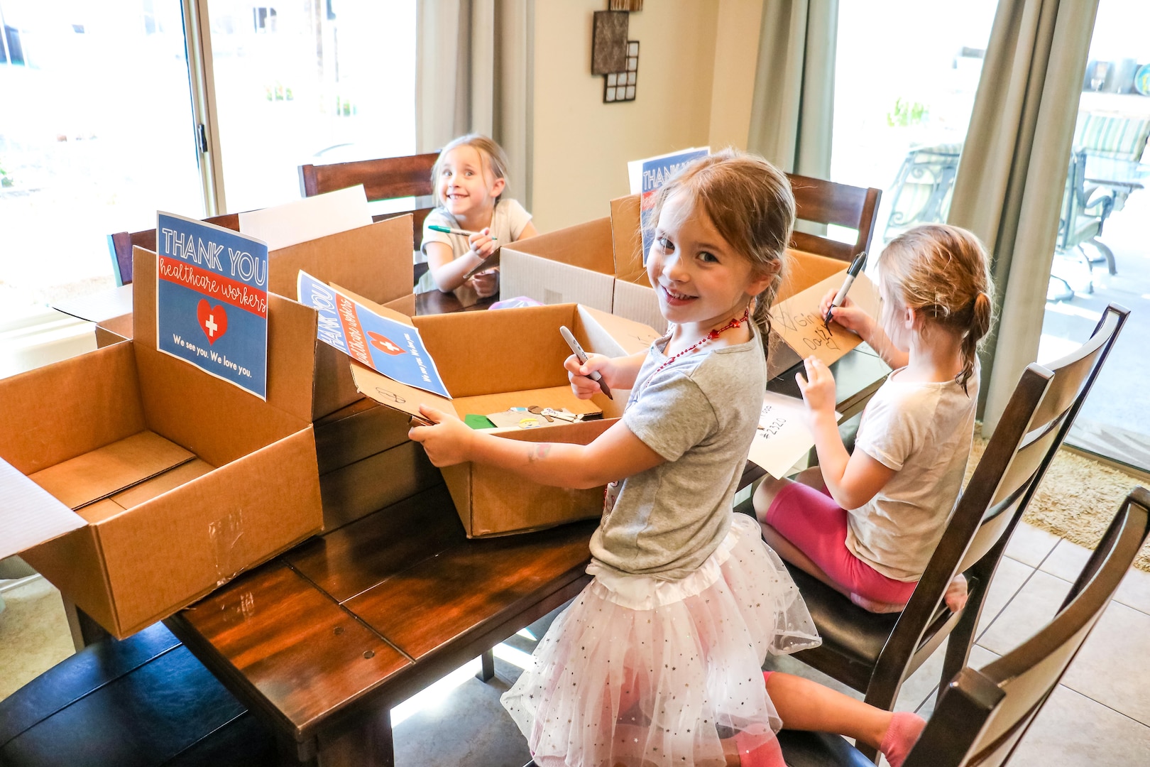 children prepare a package of treats