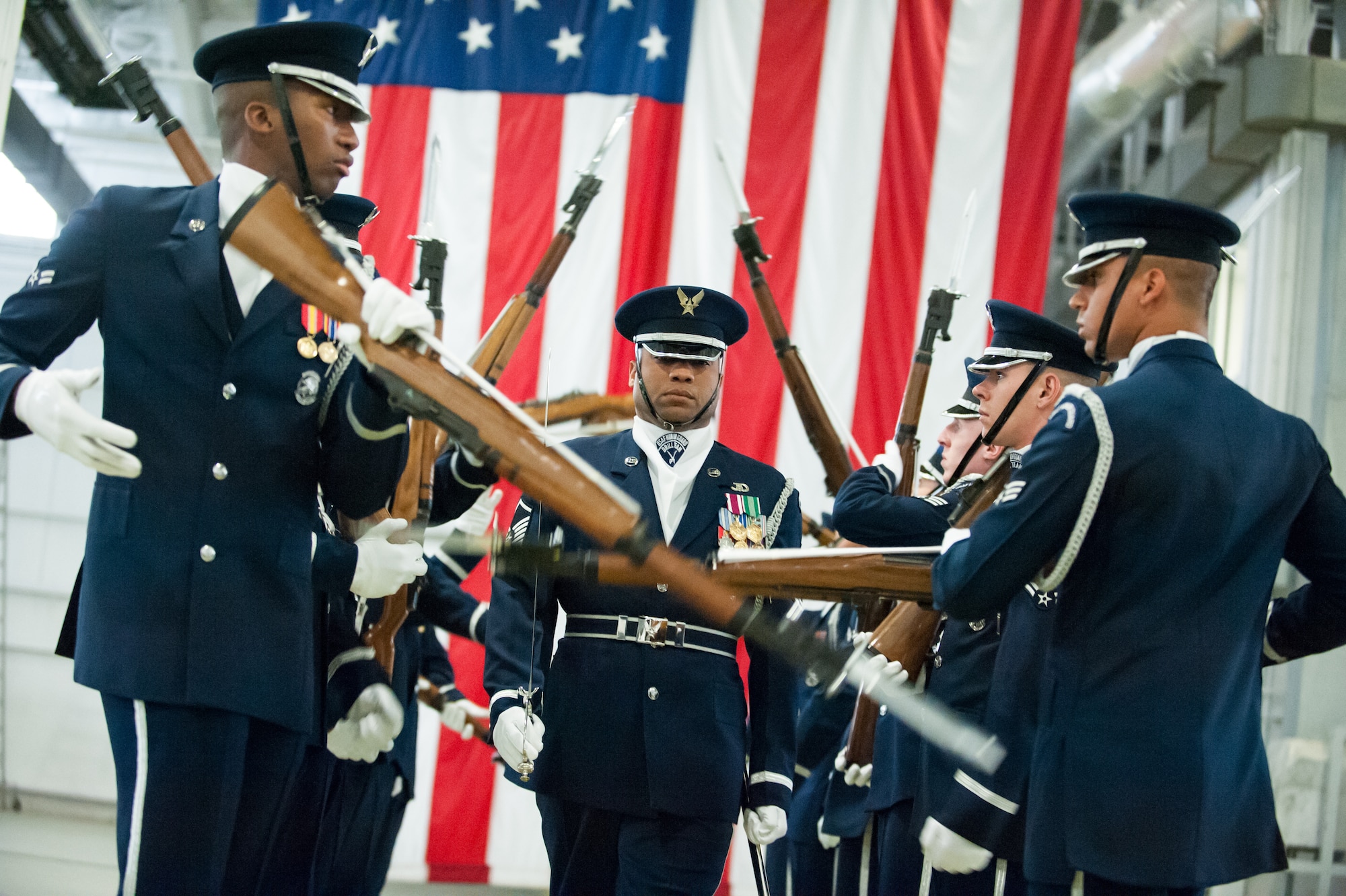 Picture of Master Sgt. Whitfield Jack, U.S. Air Force Honor Guard Drill Team superintendent walking through gauntlet maneuver with drill team members at building 1823 dock 23 on Joint Base McGuire-Dix-Lakehurst, N.J., March 27, 2013.